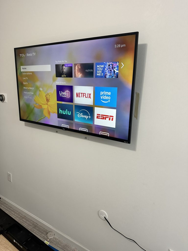 50 inch TCL Roku TV on a full motion mount with hidden in wall cable in Huntington Station, NY