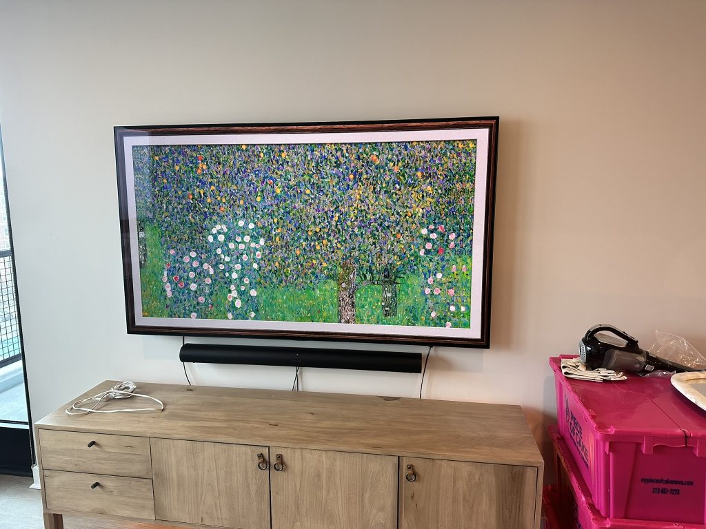 65 inch Samsung Frame TV mounted on a flat mount with a soundbar installed beneath it in Rockville Centre, NY
