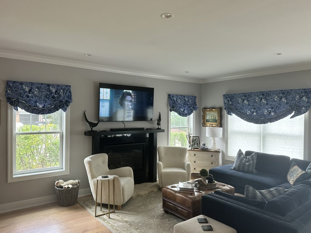 Designer tie up valances and roller blinds installed in a living room in Deer Park, NY